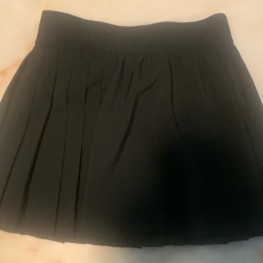 I am selling a cute black tennis skirt